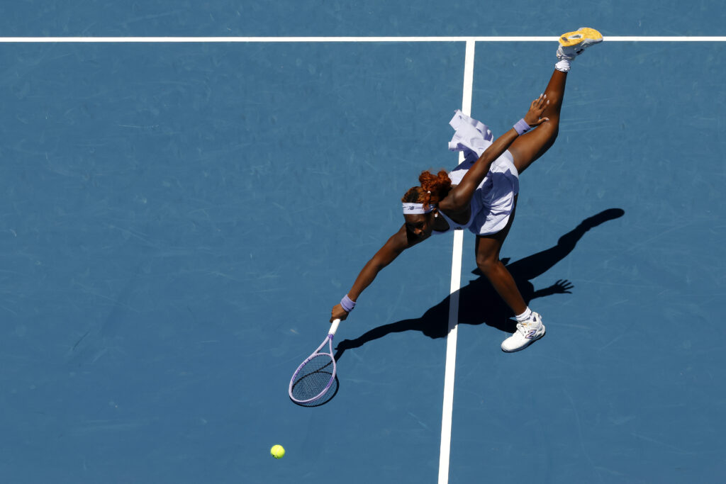 Coco Gauff stretches for a shot