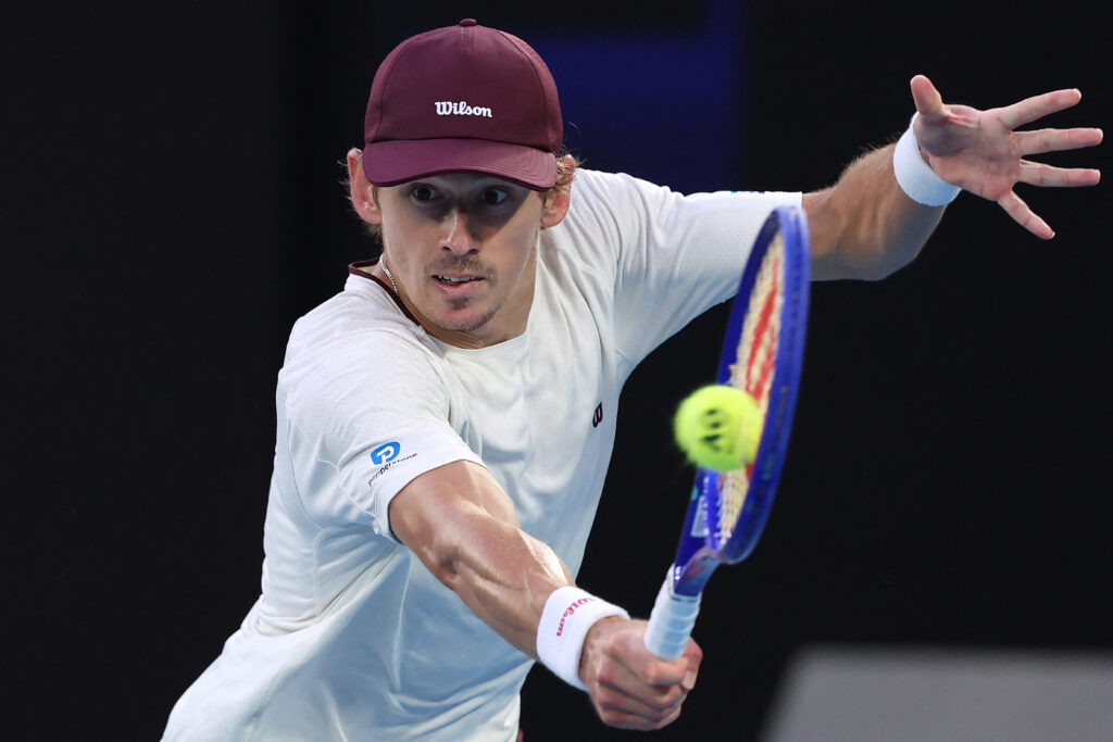 Australia's Alex De Minaur hits a return to Kazakhstan's Alexander Bublik during their men's singles match on day eight of the Australian Open tennis tournament in Melbourne on January 25, 2026.