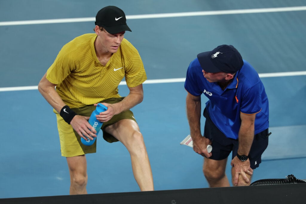 Jannik Sinner of Italy receives medical treatment in the Men's Singles Third Round against Eliot Spizzirri of the United States during day seven of the 2026 Australian Open at Melbourne Park on January 24, 2026 in Melbourne, Australia.