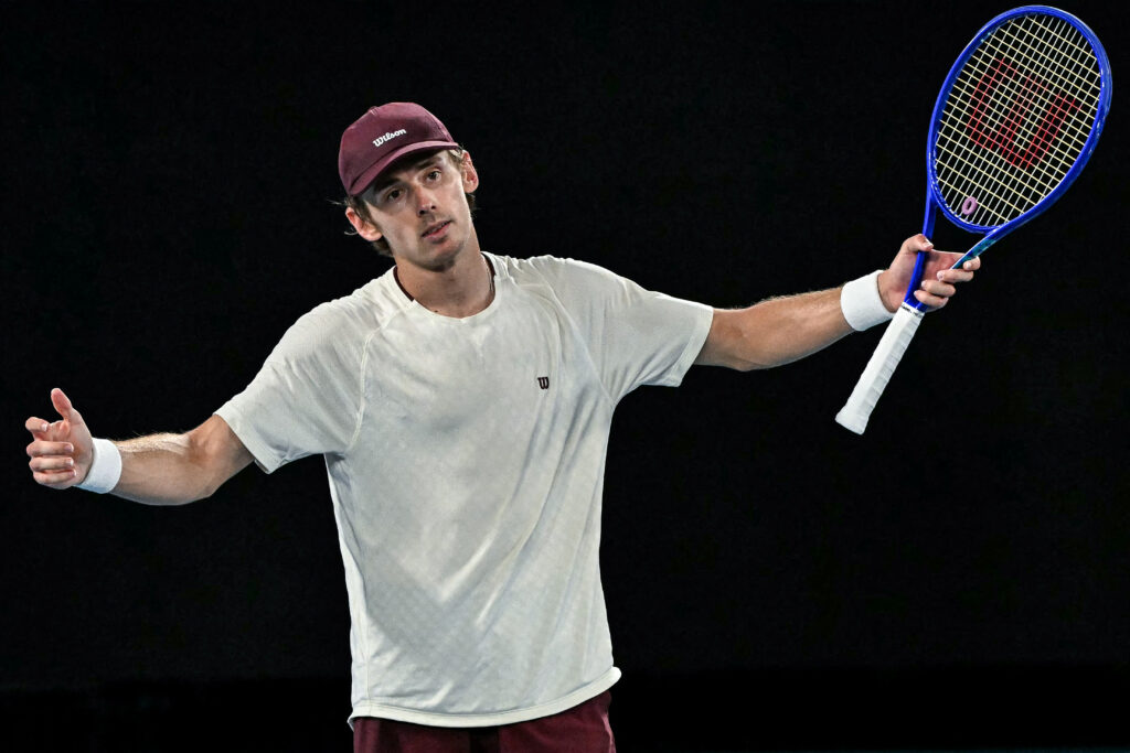 Australia's Alex De Minaur reacts after a point against Spain's Carlos Alcaraz during their men's singles quarter-final match on day ten of the Australian Open tennis tournament in Melbourne on January 27, 2026.