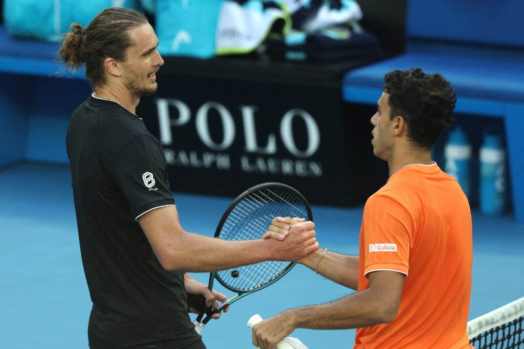 (L) of Germany shakes hands with Francisco Cerundolo of Argentina (R) after his victory in the Men's Singles Fourth Round during day eight of the 2026 Australian Open at Melbourne Park on January 25, 2026 in Melbourne, Australia.
