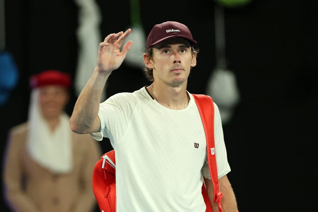 Alex de Minaur of Australia acknowledges the crowd following defeat to Carlos Alcaraz of Spain during the Men's Singles Quarter Final match on day 10 of the 2026 Australian Open at Melbourne Park on January 27, 2026 in Melbourne, Australia.