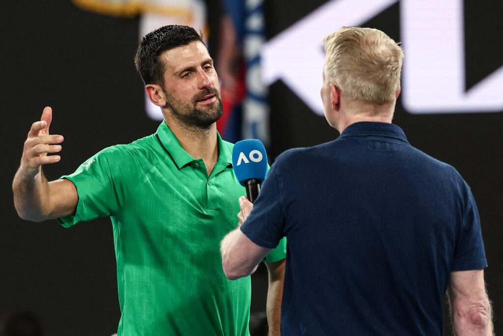 Serbia's Novak Djokovic speaks during an interview after victory over Italy's Jannik Sinner after their men's singles semi-final match on day thirteen of the Australian Open tennis tournament in Melbourne on January 31, 2026.