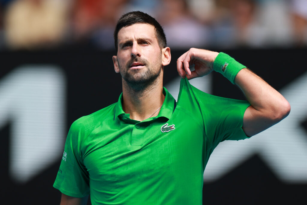 Novak Djokovic of Serbia reacts in the Men's Singles Quarterfinal against Lorenzo Musetti of Italy during day 11 of the 2026 Australian Open at Melbourne Park on January 28, 2026 in Melbourne, Australia.