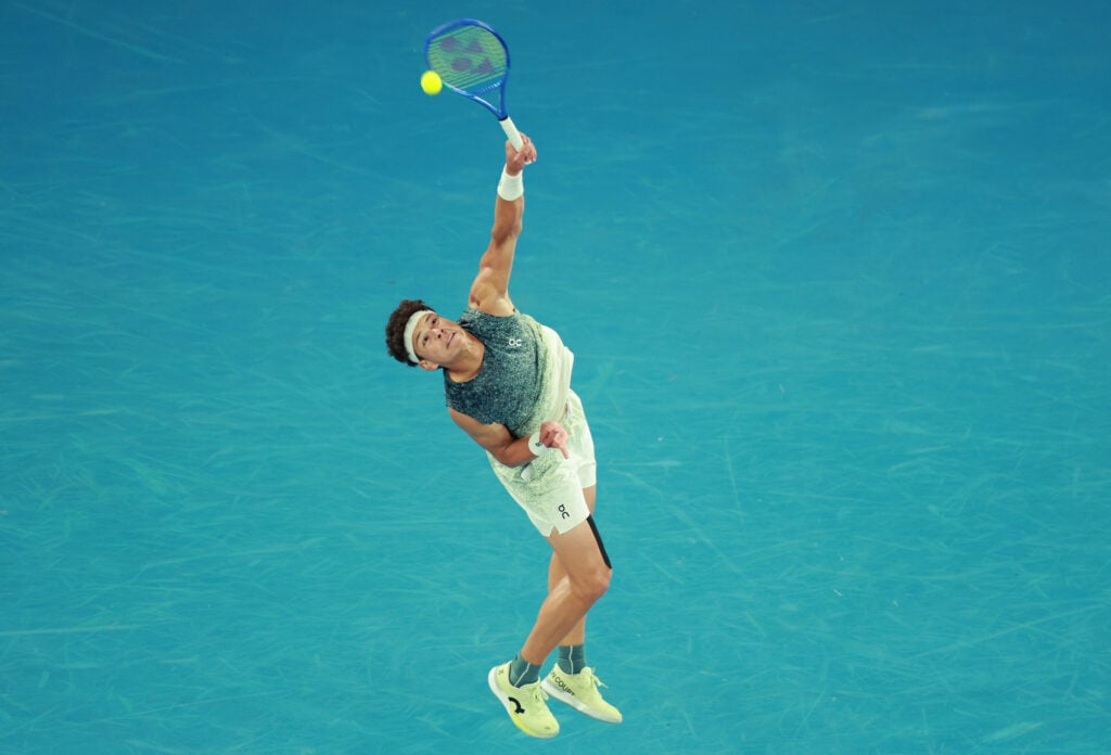 Ben Shelton of the United States serves in the Men's Singles Quarterfinal against Jannik Sinner of Italy during day 11 of the 2026 Australian Open at Melbourne Park on January 28, 2026 in Melbourne, Australia.