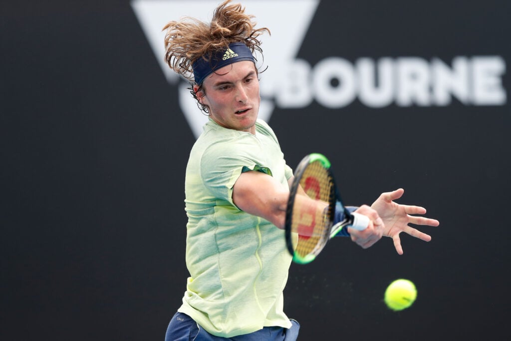 Stefanos Tsitsipas of Greece plays a forehand in his first round match against Denis Shapovalov of Canada on day one of the 2018 Australian Open at Melbourne Park on January 15, 2018 in Melbourne, Australia.