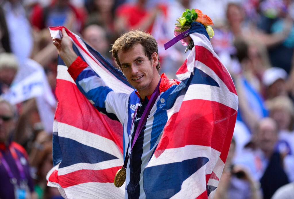 Great Britain's Andy Murray poses with his gold medal at the end of the men's singles tennis tournament of the London 2012 Olympic Games, at the All England Tennis Club in Wimbledon, southwest London, on August 5, 2012.