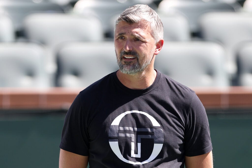 Coach Goran Ivanisevic watches Novak Djokovic of Serbia train in preparation for the BNP Paribas Open at Indian Wells Tennis Garden on March 05, 2024 in Indian Wells, California.