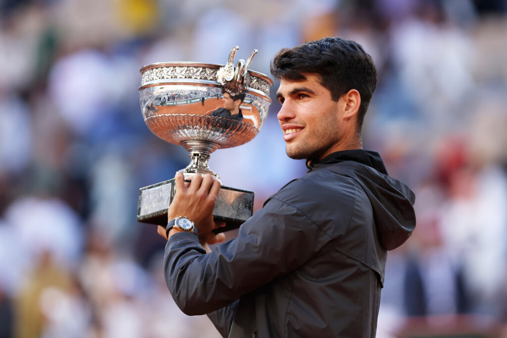 Carlos Alcaraz of Spain celebrates with the winners trophy after victory in the Men's Singles Final match between Alexander Zverev of Germany and Carlos Alcaraz of Spain on Day 15 of the 2024 French Open at Roland Garros on June 09, 2024 in Paris, France. (Photo by Dan Istitene/Getty Images
