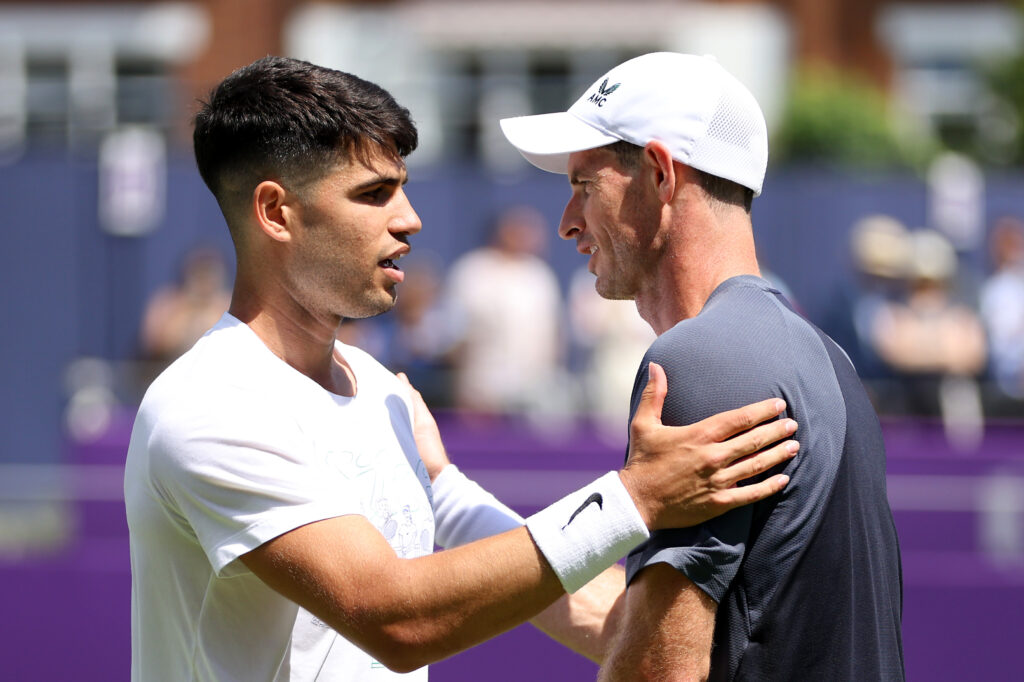 Carlos Alcaraz of Spain shakes hands with Andy Murray of Great Britain during practice on Day One of the cinch Championships at The Queen's Club on June 17, 2024 in London, England.