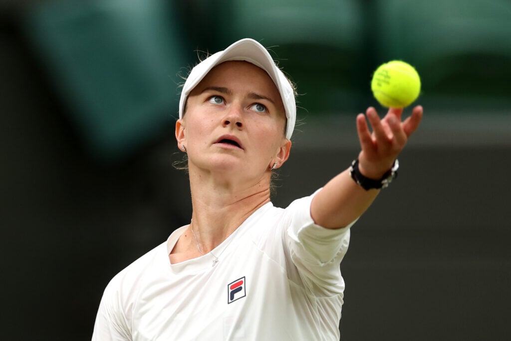 Barbora Krejcikova of Czech Republic serves to Danielle Collins of United States in her Ladies' Singles fourth round match during day eight of The Championships Wimbledon 2024 at All England Lawn Tennis and Croquet Club on July 08, 2024 in London, England.