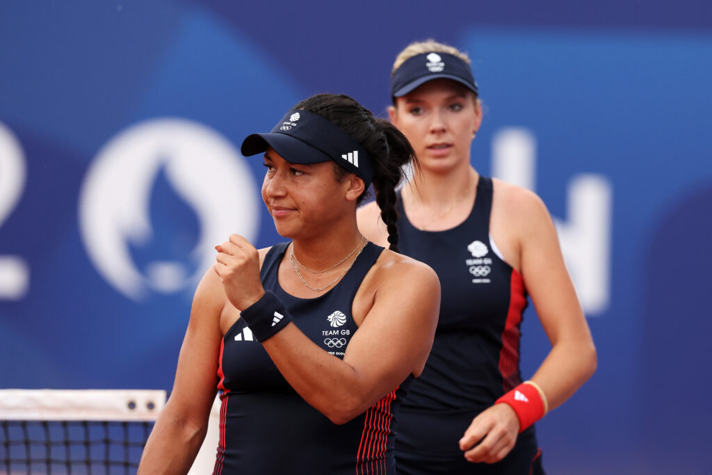 Heather Watson of Team Great Britain celebrates as partner Katie Boulter of Team Great Britain looks on against Beatriz Haddad Maia of Team Brazil and Luisa Stefani of Team Brazil during the Women's Doubles Second Round match on day five of the Olympic Games Paris 2024 at Roland Garros on July 31, 2024 in Paris, France.