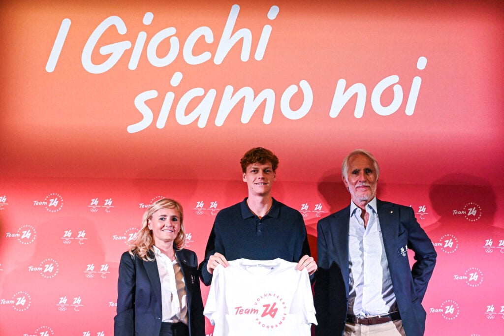 From left : Chief Strategy Planning & Legacy Officer of the Milano-Cortina 2026 Foundation, Diana Bianchedi, Official Ambassador of the Milano-Cortina 2026 volunteer program, Italy's tennis player Jannik Sinner, and President of the Milano-Cortina 2026 Foundation and of the Italian National Olympic Commitee (CONI), Giovanni Malagò, attend a press conference to present Team26, the program dedicated to the volunteers of Milano Cortina 2026 winter olympic games, in Milan on September 19, 2024.