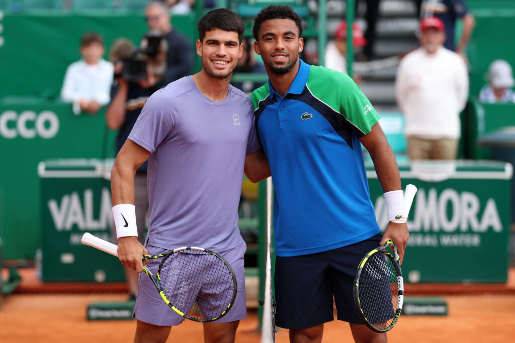 Arthur Fils and Carlos Alcaraz pose at the net
