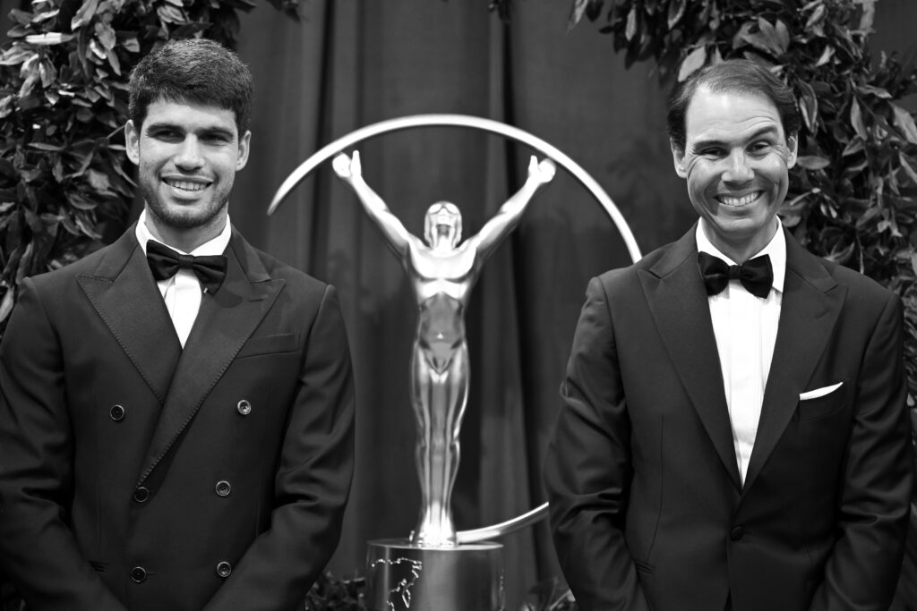 Carlos Alcaraz and Rafa Nadal pose with the Laureus trophy and wreath on the red carpet during the Laureus World Sports Awards Madrid 2025 at Galería de Cristal on April 21, 2025 in Madrid, Spain.