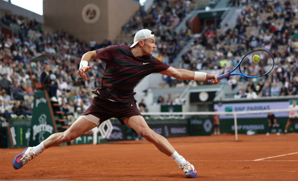 Jack Draper of Great Britain plays a backhand against Mattia Bellucci of Italy during the Men's Singles First Round match on Day Three of the 2025 French Open at Roland Garros on May 27, 2025 in Paris, France.