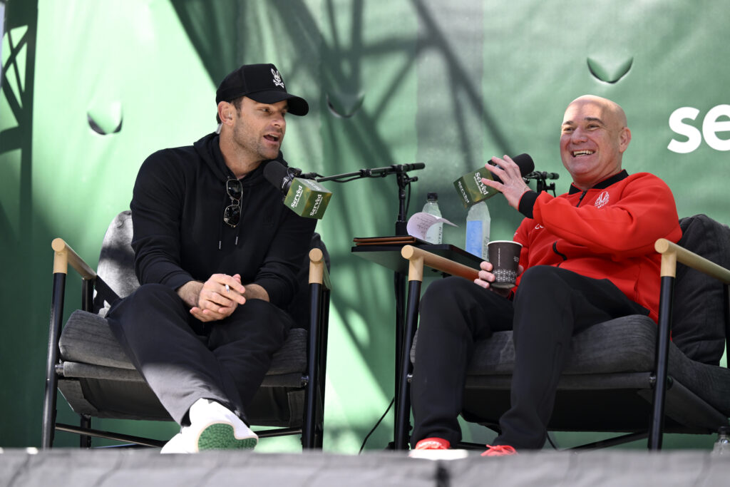 Team World Captain Andre Agassi (R) speaks with Former tennis player Andy Roddick (L) on the Served podcast prior to the start of the Laver Cup 2025 on September 18, 2025 in San Francisco, California.