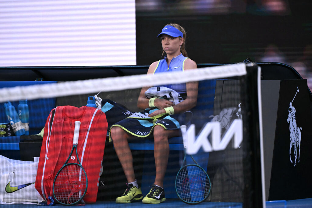 Britain's Katie Boulter looks on between games against Switzerland's Belinda Bencic during their women's singles match on day three of the Australian Open tennis tournament in Melbourne on January 20, 2026.
