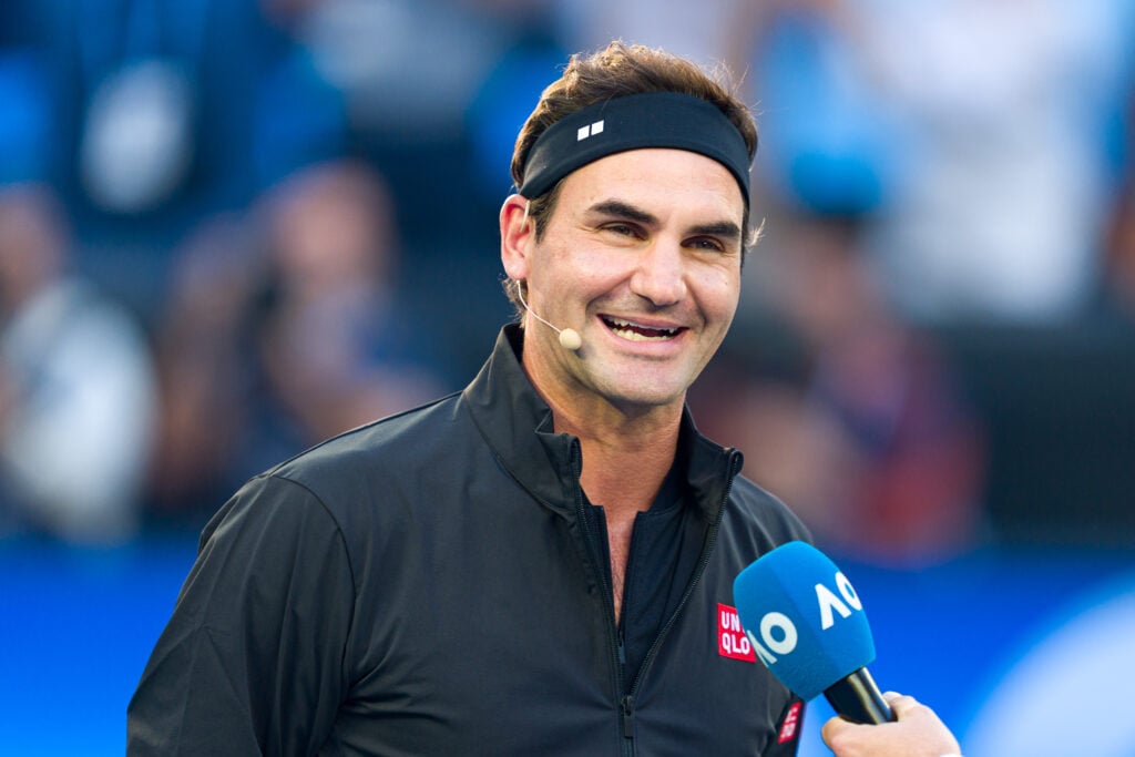 Roger Federer of Switzerland gives an on-court interview as he enters the arena during the Opening Ceremony ahead of the 2026 Australian Open at Melbourne Park on January 17, 2026 in Melbourne, Australia.