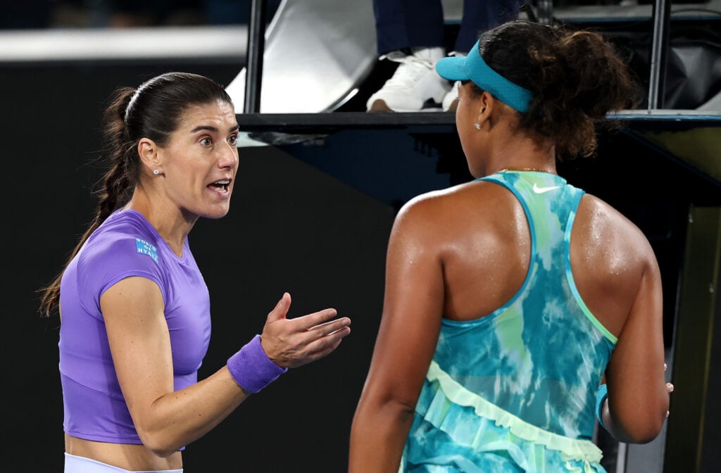 Naomi Osaka of Japan and Sorana Cirstea of Romania interact following the Women's Singles Second Round during day five of the 2026 Australian Open at Melbourne Park on January 22, 2026 in Melbourne, Australia.