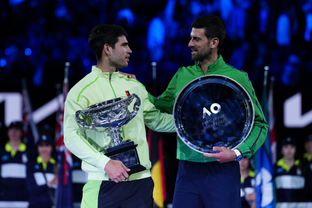Carlos Alcaraz of Spain poses with the Norman Brookes Challenge Cup during the official presentation after defeating their Men's Singles Final match against Novak Djokovic of Serbia during day 15 of the 2026 Australian Open at Melbourne Park on February 1, 2026 in Melbourne, Australia.