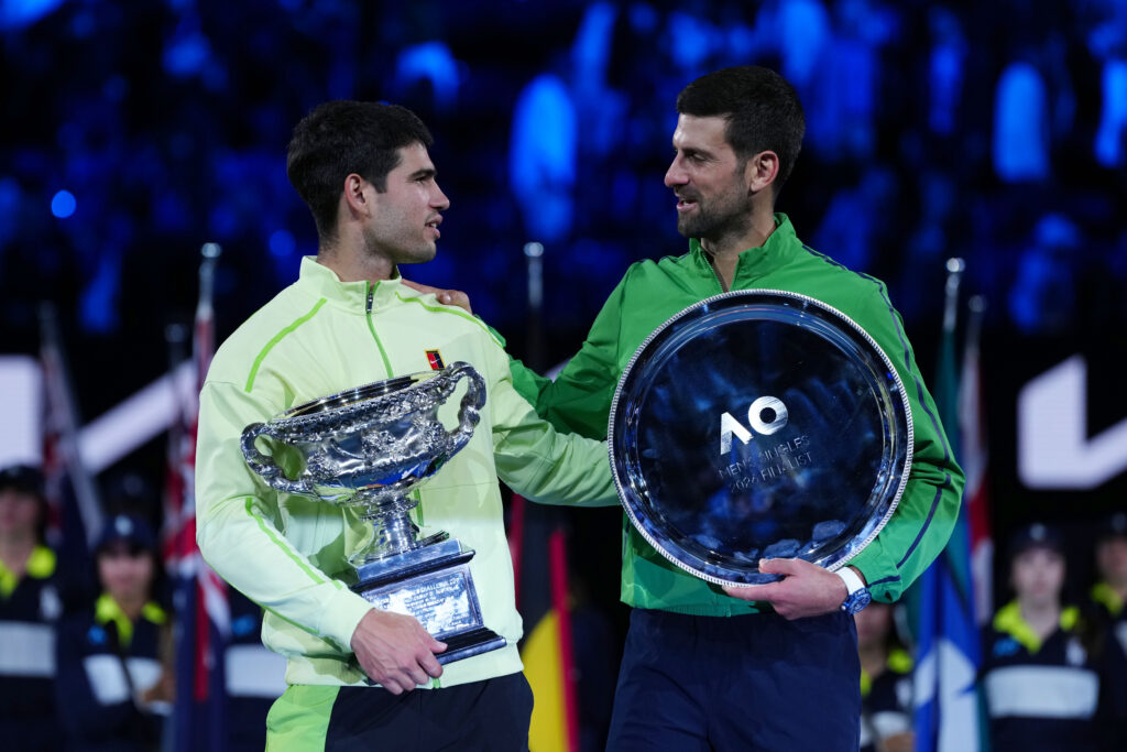Carlos Alcaraz and Novak Djokovic chat with their trophies