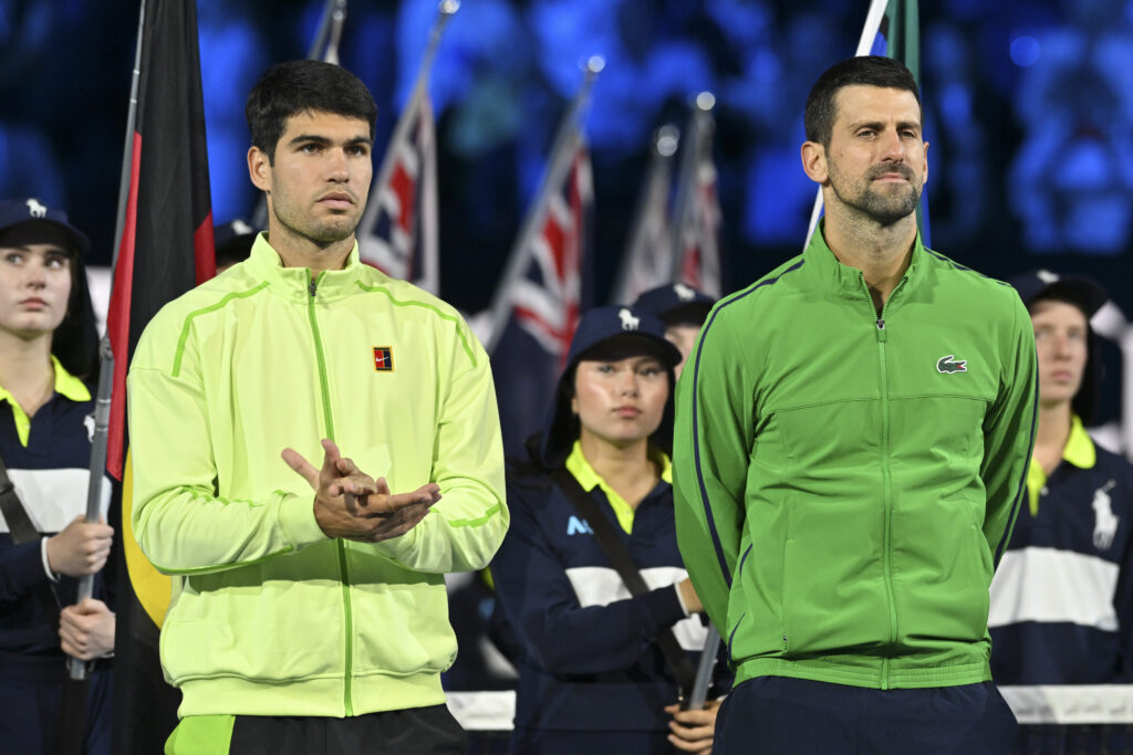Spain's Carlos Alcaraz and Serbia's Novak Djokovic during speeches at the end of the mens final Day 15 of the Australian Open. tennis tournament in Melbourne on February 01, 2026.