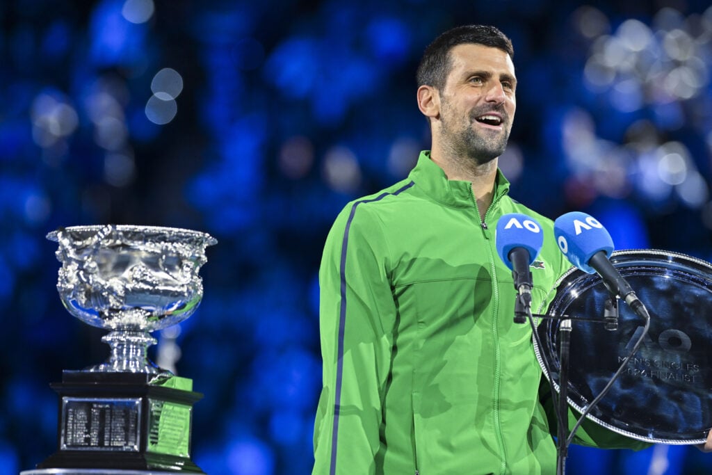 Serbia's Novak Djokovic speaks after receiving the runner-up shield following his defeat to Spain's Carlos Alcaraz in the men's singles final on Day 15 of the Australian Open. tennis tournament in Melbourne on February 01, 2026.