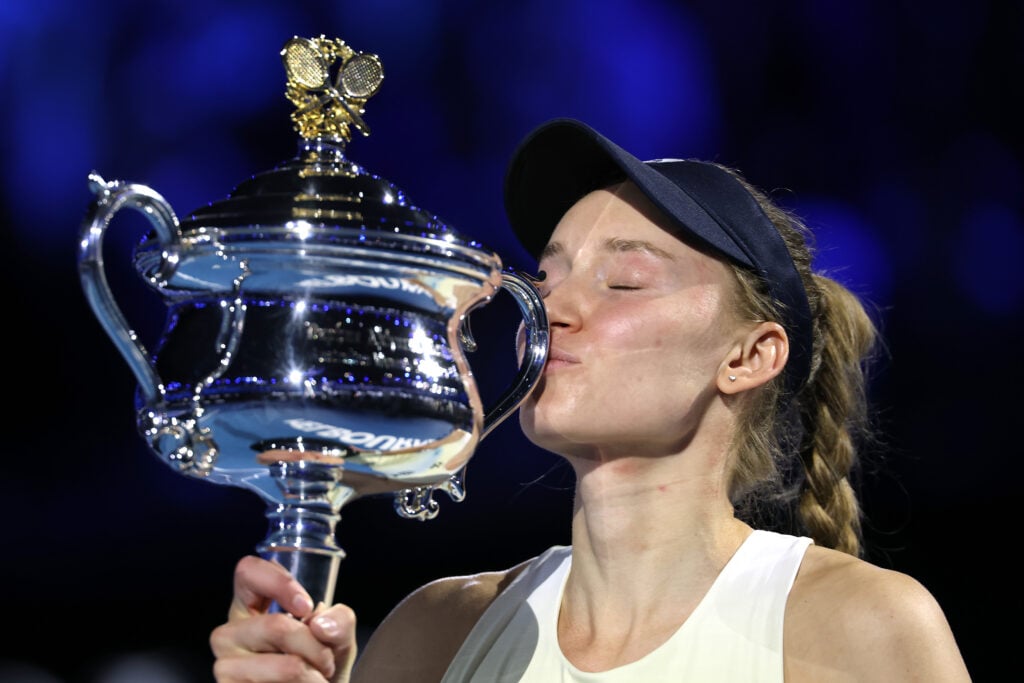 Elena Rybakina of Kazakhstan kisses the Daphne Akhurst Memorial Cup after her victory in the Women's Singles Final against Aryna Sabalenka during day 14 of the 2026 Australian Open at Melbourne Park on January 31, 2026 in Melbourne, Australia.