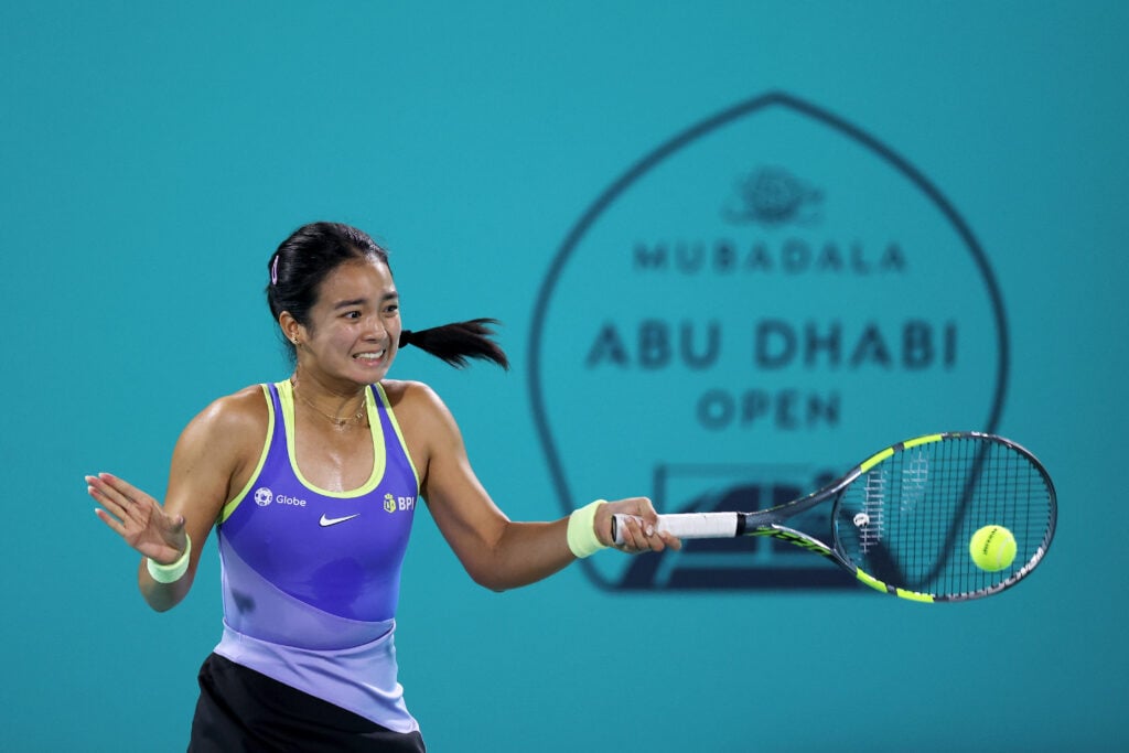 Alexandra Eala of the Philippines plays a forehand against Zeynep Sonmez of Turkey in the first round during day two of the Mubadala Abu Dhabi Open