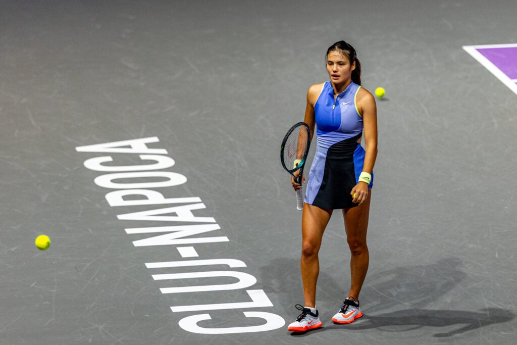 Emma Raducanu walks on court