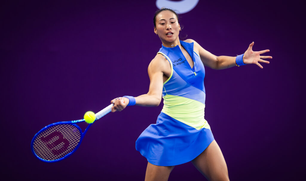 Qinwen Zheng of China in action against Sofia Kenin of the United States in the first round on Day Two of the Qatar TotalEnergies Open, part of the Hologic WTA Tour at Khalifa International Tennis and Squash Complex on February 09, 2026 in Doha, Qatar