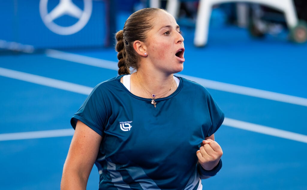 Jelena Ostapenko of Latvia in action against Camila Osorio of Colombia in the third round on Day Four of the Qatar TotalEnergies Open, part of the Hologic WTA Tour at Khalifa International Tennis and Squash Complex on February 11, 2026 in Doha, Qatar