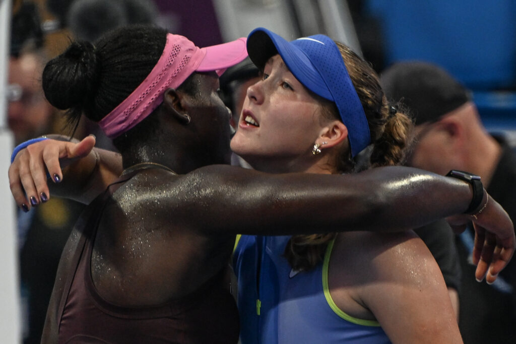 Victoria Mboko (L) of Canada wins against Mirra Andreeva (R) in the Round of 16 on Day Four of the Qatar TotalEnergies Open, part of the Hologic WTA Tour, at the Khalifa International Tennis and Squash Complex on February 11, 2026 in Doha, Qatar.
