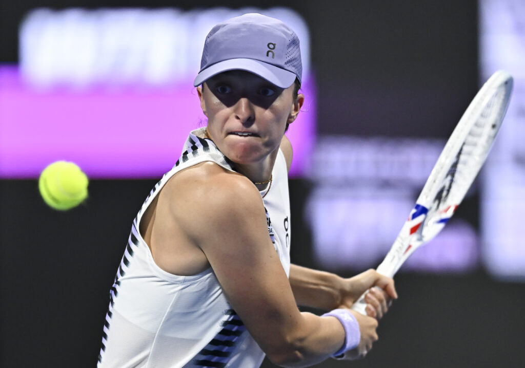 Iga Swiatek of Poland plays against Daria Kasatkina of Australia (not in view) during their round of 16 match at the WTA Qatar TotalEnergies Open 2026 tennis tournament at the Khalifa International Tennis Complex. Iga Swiatek won against Daria Kasatkina 5-7,6-1,6-1
