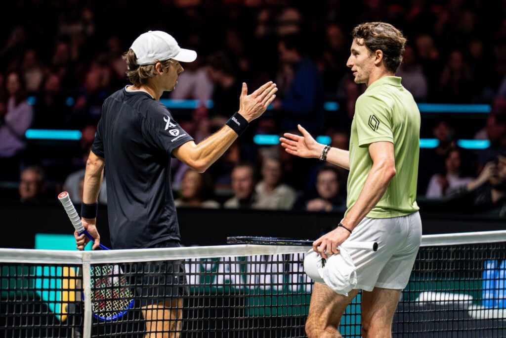 Alex de Minaur, Ugo Humbert shake hands after their match during Day Six of the ABN AMRO Open at Rotterdam Ahoy on February 14, 2026 in Rotterdam, Netherlands.