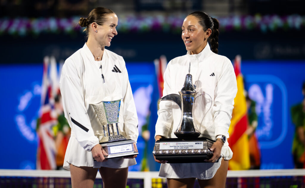 Elina Svitolina and Jessica Pegula hold their trophies