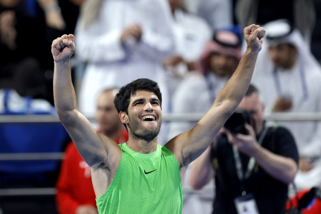 Carlos Alcaraz of Spain celebrates after winning against Arthur Fils of France during their men's singles final match at the Qatar ExxonMobil Open at Khalifa International Tennis and Squash Complex on February 21, 2026 in Doha, Qatar.