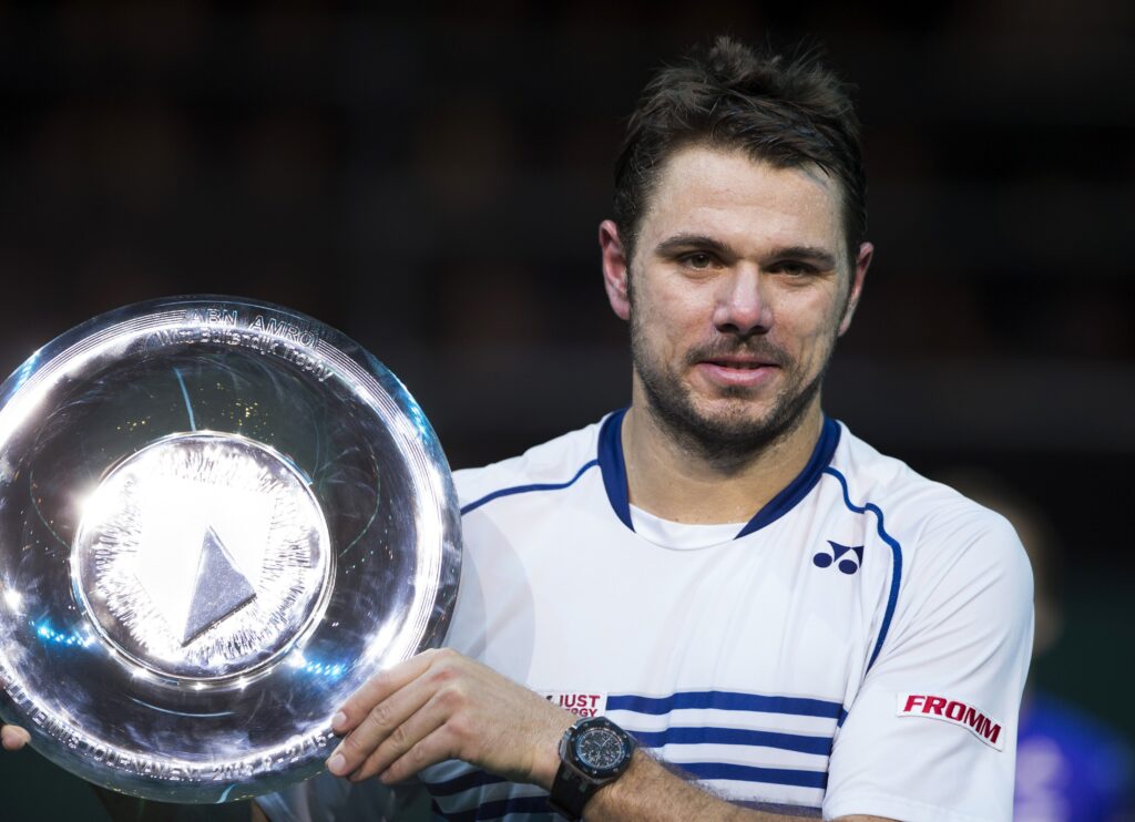 Stanislas Wawrinka of Switzerland poses with his trophy after winning against Czech Tomas Berdych on February 15, 2015 at the final at the ABN AMRO Tennis Tournament in Ahoy, Rotterdam.