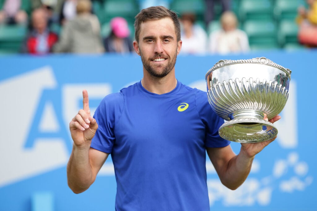 Steve Johnson of the United States poses with his trophy after defeating Pablo Cuevas of Uruguay in his men's singles final match during day six of the ATP Aegon Open Nottingham at Nottingham Tennis Centre on June 25, 2016 in Nottingham, England.