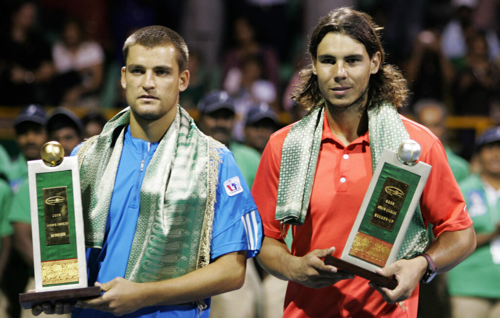 Spanish tennis player Rafael Nadal (R) and Russian Mikhail Youzhny pose with their respective trophies after the conclusion of the final at The ATP Chennai Open 2008 in Chennai, 06 January 2008. Youzhny won the match 6-0,6-1.