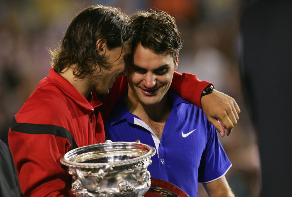 Rafael Nadal of Spain consoles Roger Federer of Switzerland during the trophy presentation after his men's final match during day fourteen of the 2009 Australian Open at Melbourne Park on February 1, 2009 in Melbourne, Australia