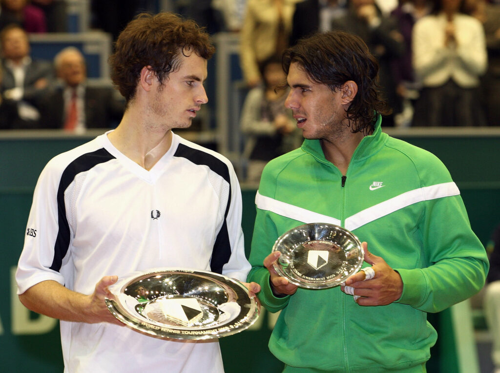 Andy Murray (L) of Great Britain with the winner's trophy with Rafael Nadal of Spain with the runners up's trophy after the singles final match during day seven of the ABN AMRO World Tennis Tournament at the Ahoy Centre Rotterdam on February 15, 2009 in Rotterdam, Netherlands.