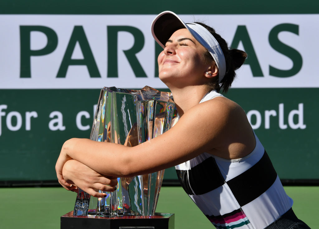 Bianca Andreescu (CAN) hugs the winners trophy after Andreescu defeated Angelique Kerber (GER) to become the 2019 BNP Paribas Open Champion after a finals match played on March 17, 2019 at the Indian Wells Tennis Garden in Indian Wells, CA.