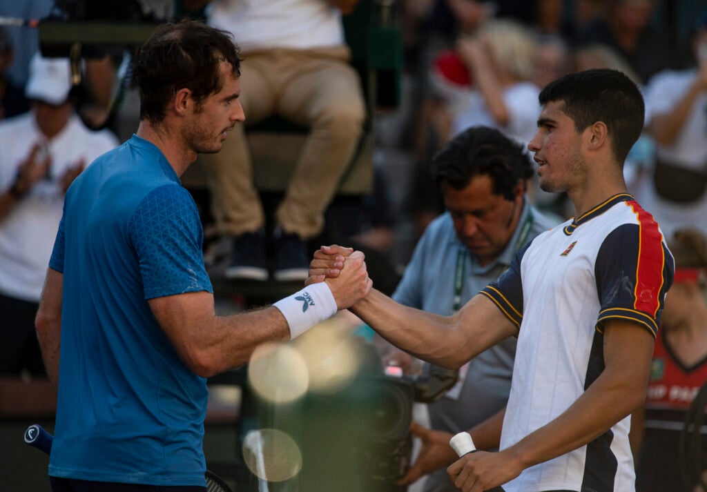 Andy Murray of Great Britain shakes hands with Carlos Alcaraz of Spain after beating him in the third round of the BNP Paribas Open at the Indian Wells Tennis Garden on October 10, 2021 in Indian Wells, California.