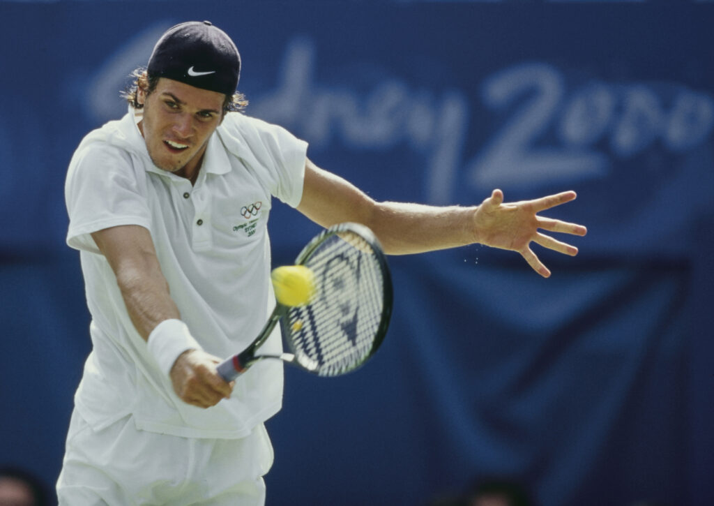 Tommy Haas of Germany plays a backhand return to Yevgeny Kafelnikov of Russia during their Men's Singles Final match at the XXVII Summer Olympic Games on 28th September 2000 at the NSW Tennis Centre in Sydney, Australia. Yevgeny Kafelnikov won the match 7 - 6, 3 - 6, 6 - 2, 4 - 6, 6 - 3.