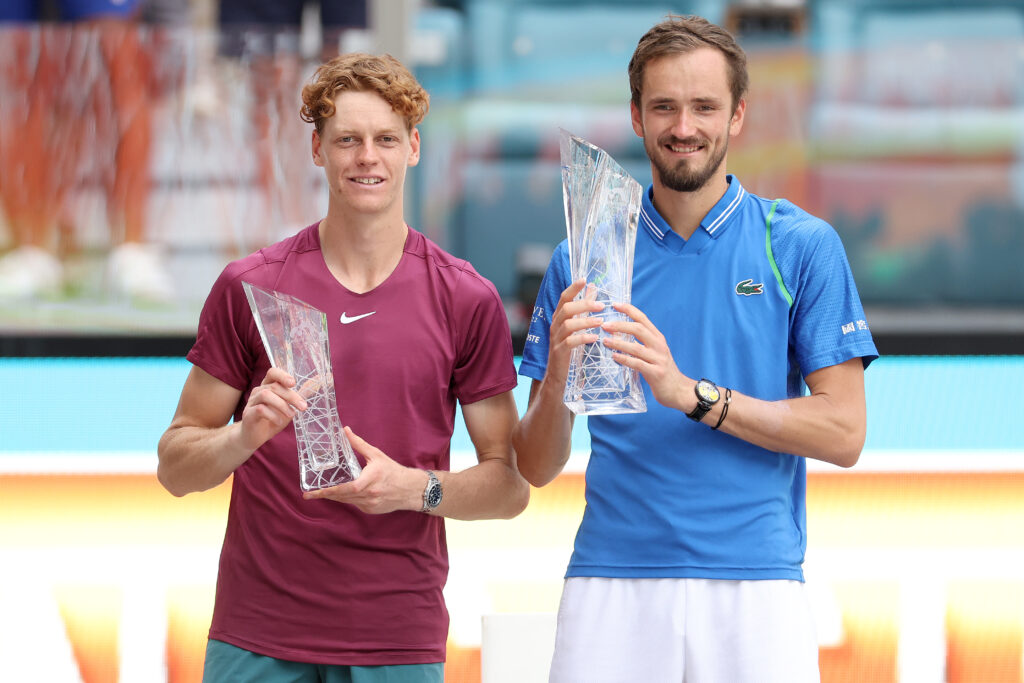 Jannik SInner of Italy and Daniil Medvedev of Russia pose with their trophies after their match during the Men's Final of the Miami Open at Hard Rock Stadium on April 02, 2023 in Miami Gardens, Florida.