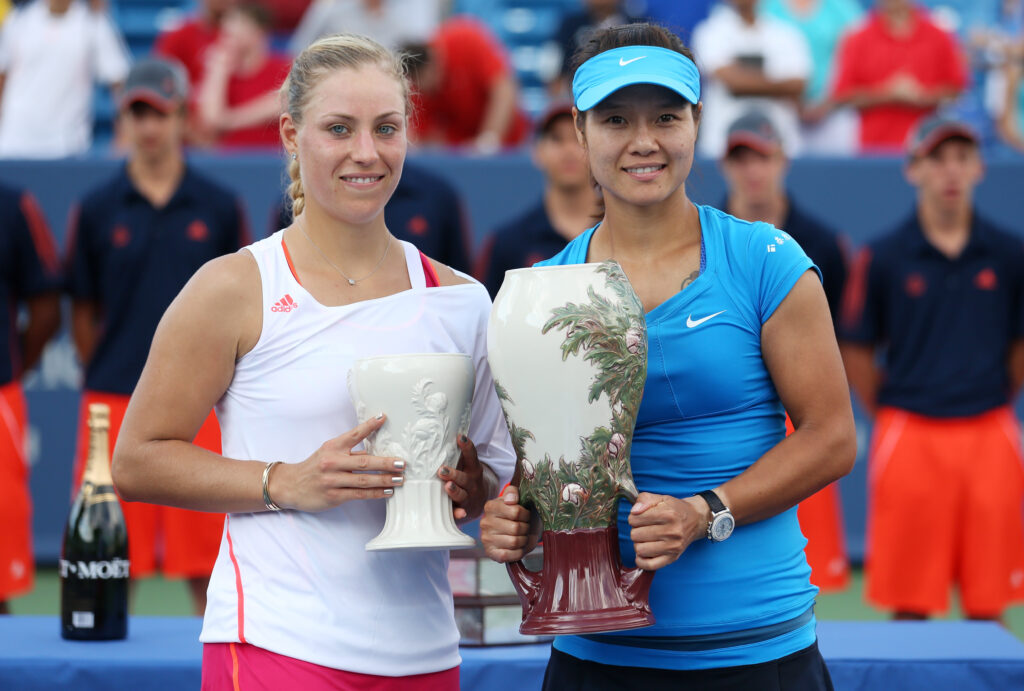 Winner Li Na of China holds her trophy with finalist Angelique Kerber of Germany during the final on day nine of the Western & Southern Open at Lindner Family Tennis Center on August 19, 2012 in Mason, Ohio.