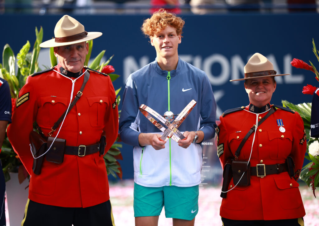 Jannik Sinner of Italy poses with Canadian Mounties after his win against Alex De Minaur of Australia in the Singles Final during Day Seven of the National Bank Open, part of the Hologic ATP Tour, at Sobeys Stadium on August 13, 2023 in Toronto, Canada.