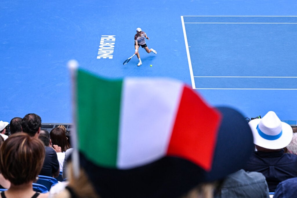 Italian flag waves while Jannik Sinner plays at the Australian Open